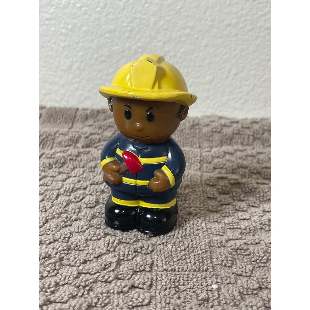 Fisher-Price Little People Firefighter Figure Blue Yellow Uniform Axe Good